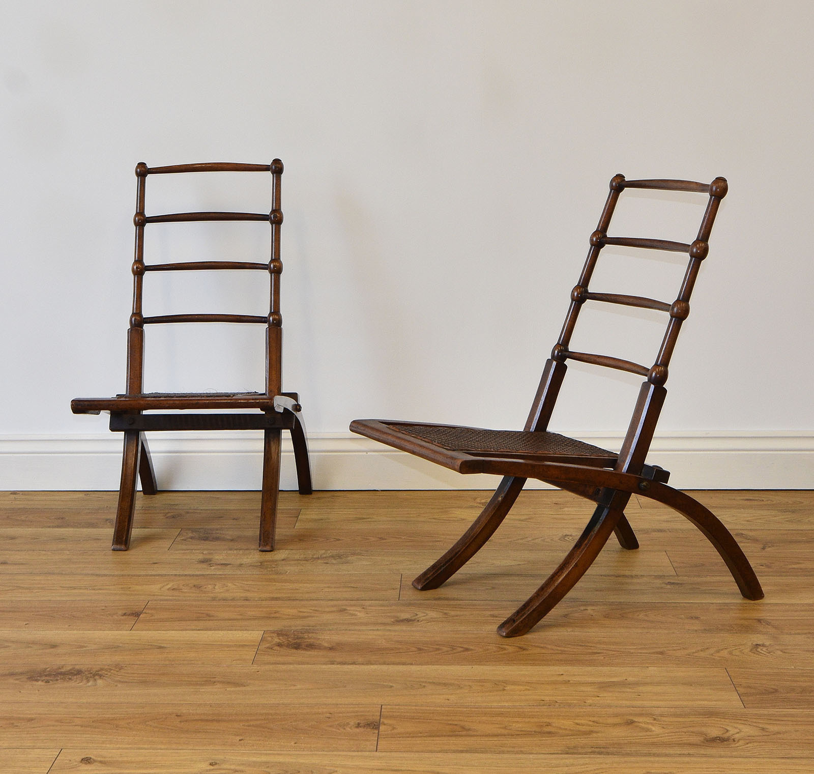 Pair Of Antique Aesthetic Movement Walnut Folding Chairs In The