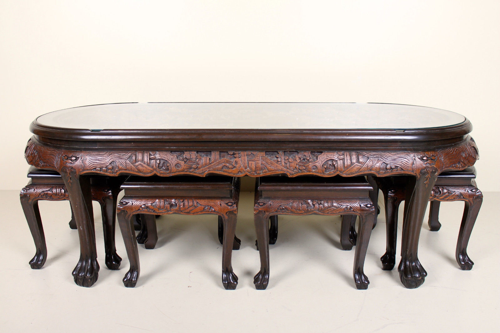 Chinese Coffee Table With Hand Carved Battle Scene And Six Stools