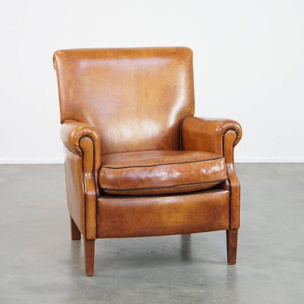 Comfortable, Neat Sheepskin Armchair, Neatly Finished With Black Piping And In Good Condition