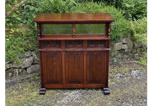 A Wood Brothers Old Charm Tudor Brown Carved Oak Drinks Bar
