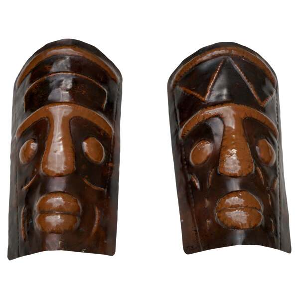 Two Hammered Copper Sconces In The Shape Of African Masks