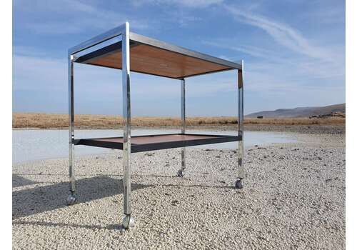 A 1970s, Two Tier, Chrome And Teak Drinks Trolley Manufactured By Howard Miller Associates
