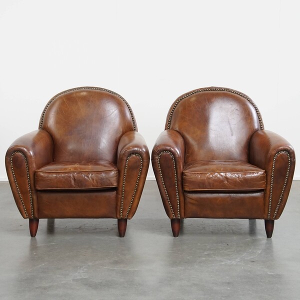 Set Of 2 Stylish And Timeless Cowhide Designer Armchairs With Beautiful Round Shapes