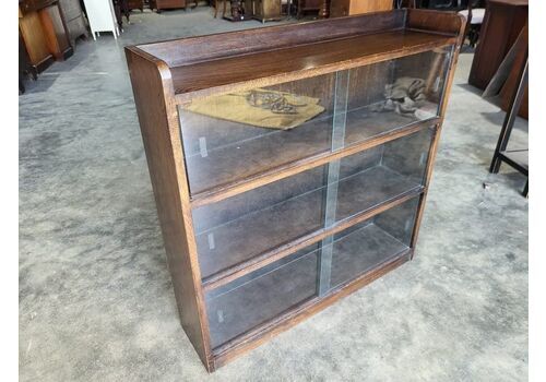 20thc Small Dark Oak Low Glazed 3 Tier Sliding Door Bookcase
