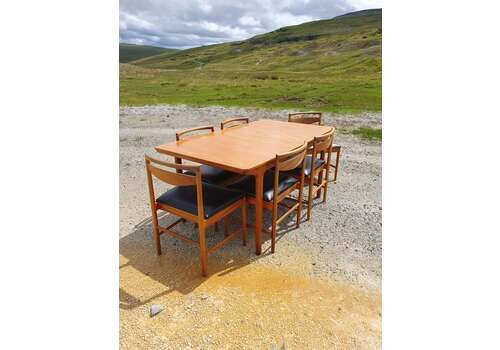 A Mid 20thc Teak, Extending Dining Table And Six Chairs By McIntosh Of Kirkcaldy.