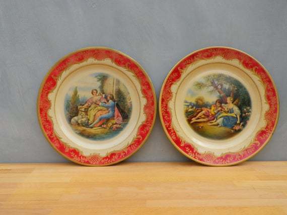 A Pair Of 1950s Portland Ware Tin Display Plates The Shepherdess