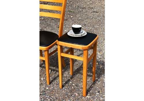A Reupholstered Retro Black Vinyl Stool